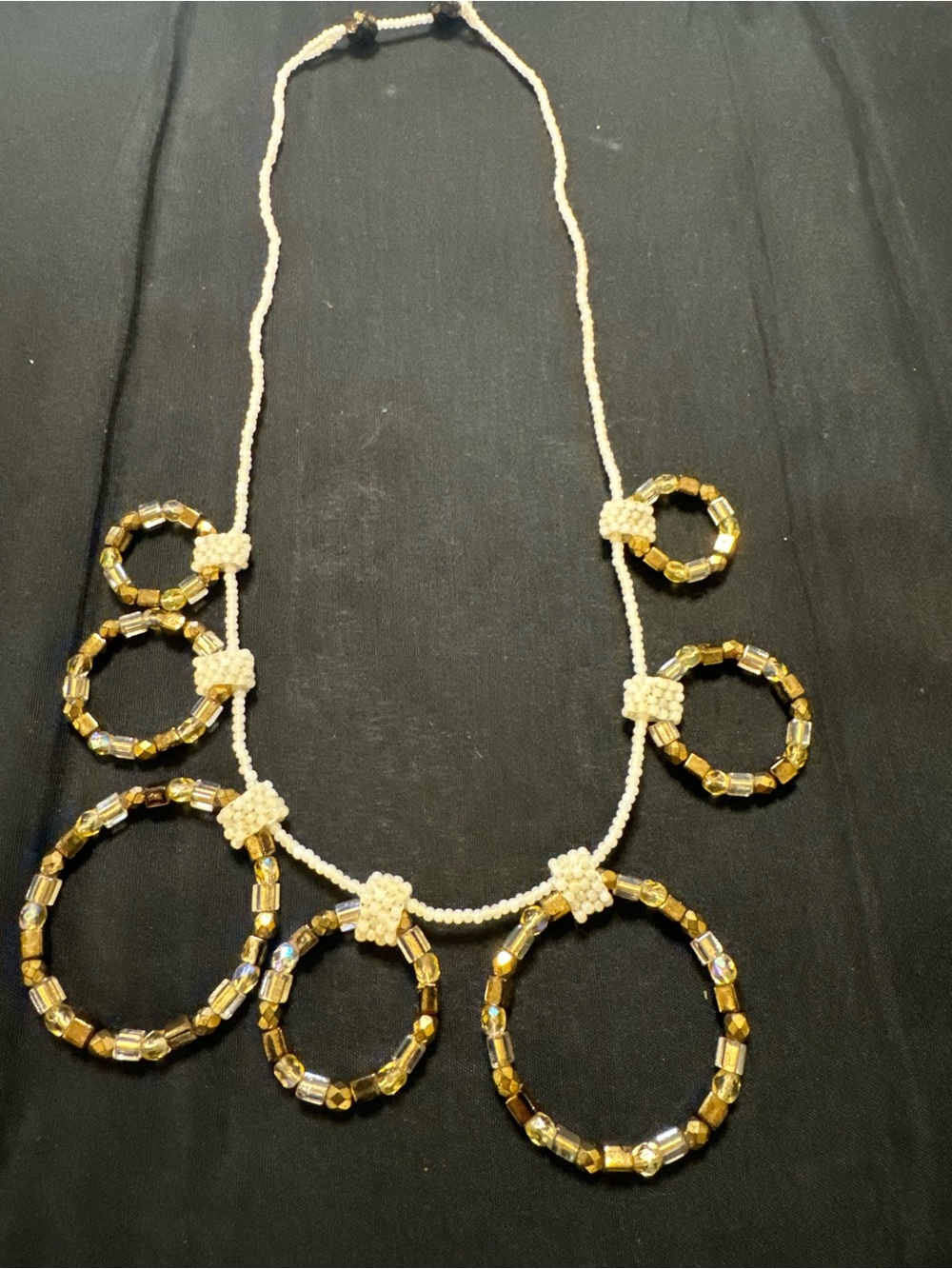 Handcrafted Gold Bead Hoop Statement Necklace - White Accent